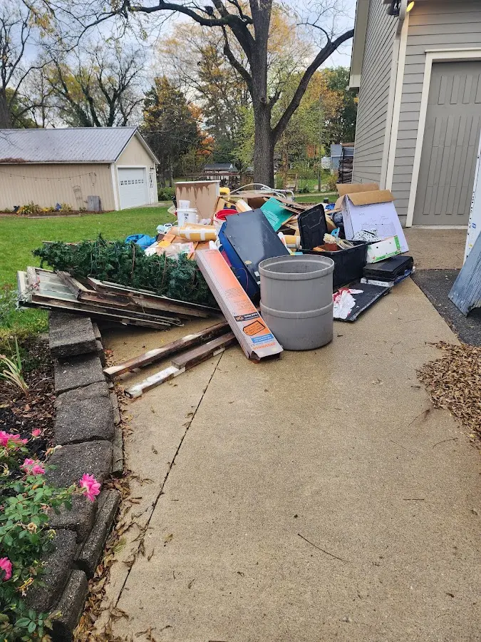 Dumpster being loaded with debris for Commercial Dumpster Rental in Dearborn